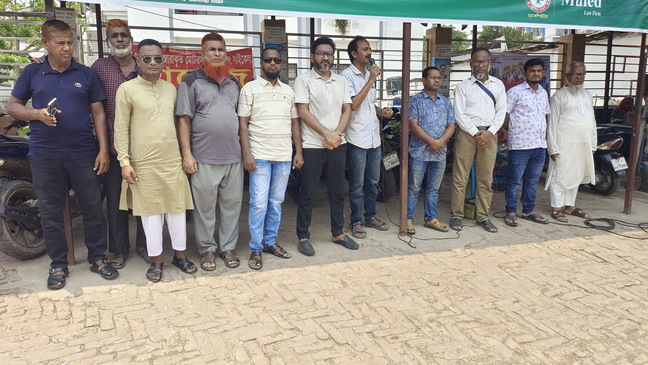 Human chain demanding safe roads in Naogaon, demand to shift bus stand outside the city